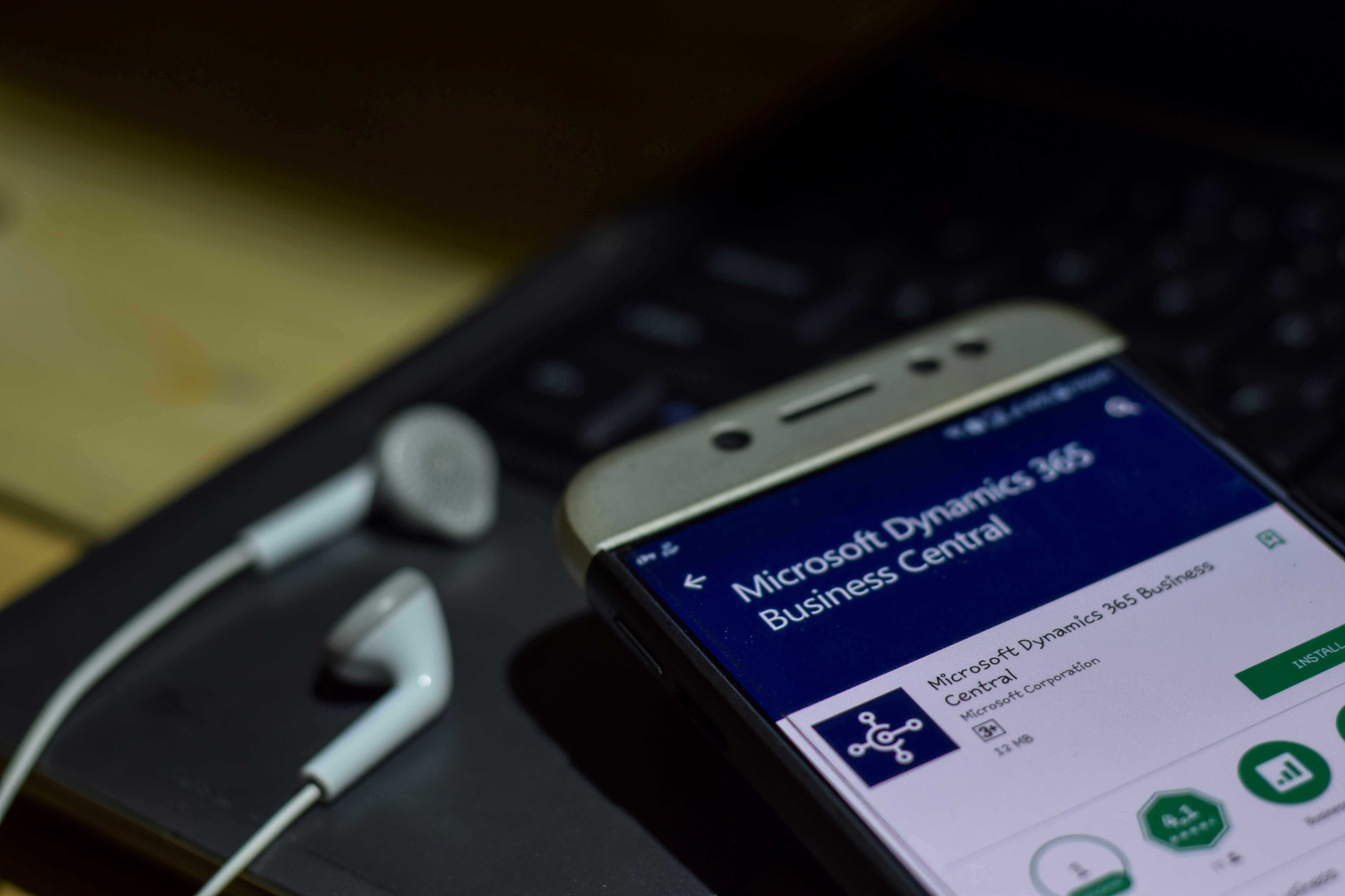 Microsoft Dynamics 365 Business Central dev application on Smartphone screen. Dynamics 365 Business Central is a freeware web browser developed by Microsoft Corporation