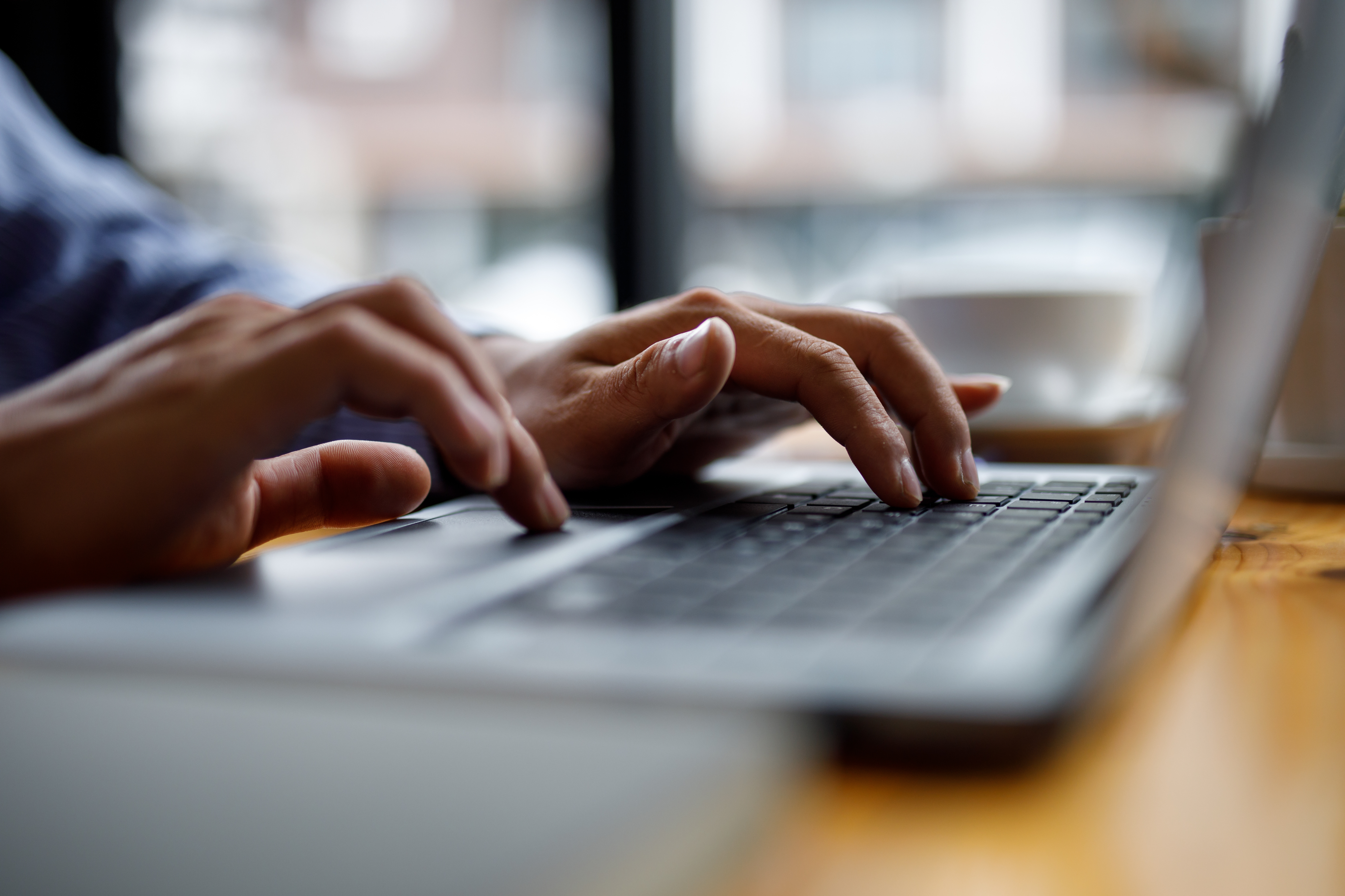 Close up of hands typing on computer keyboard panoramic banner, businessman using laptop at home,