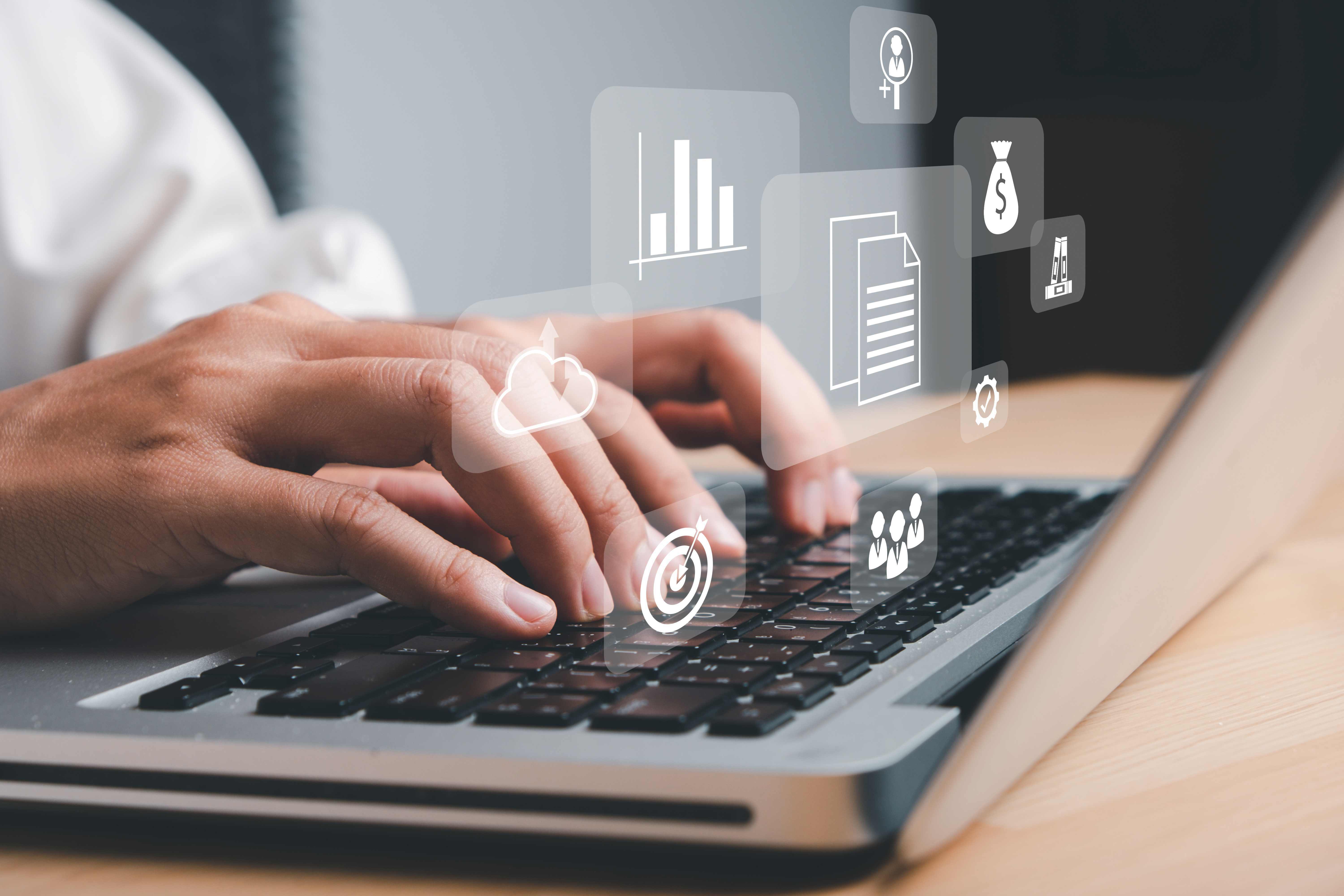 Enterprise Resource Planning ERP, document management concept with icons on virtual screen, Business woman working with laptop computer with icons on virtual screen on office desk.