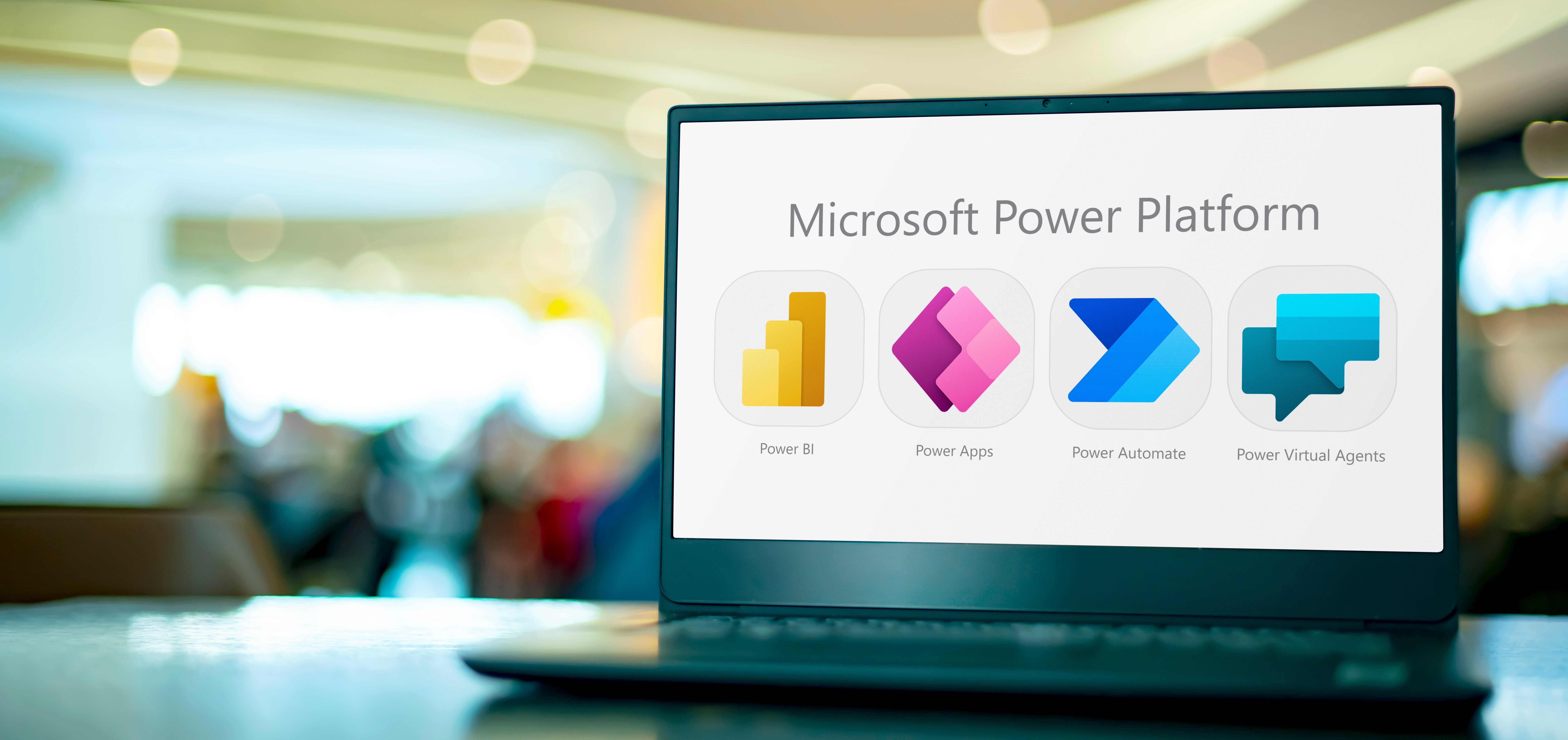 Laptop computer displaying icons of Microsoft Power Platform