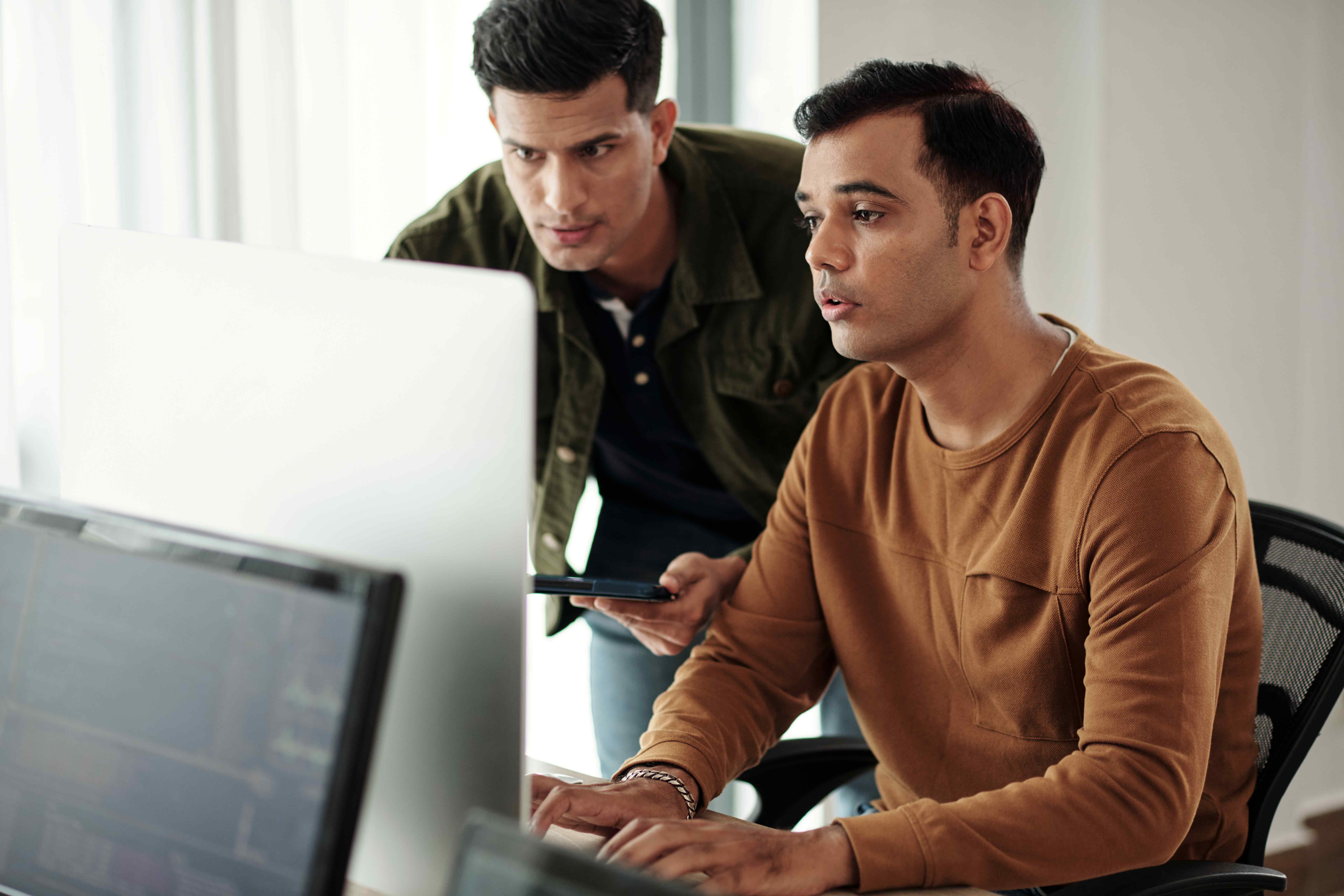 Developers troubleshooting issues with crashed website of company