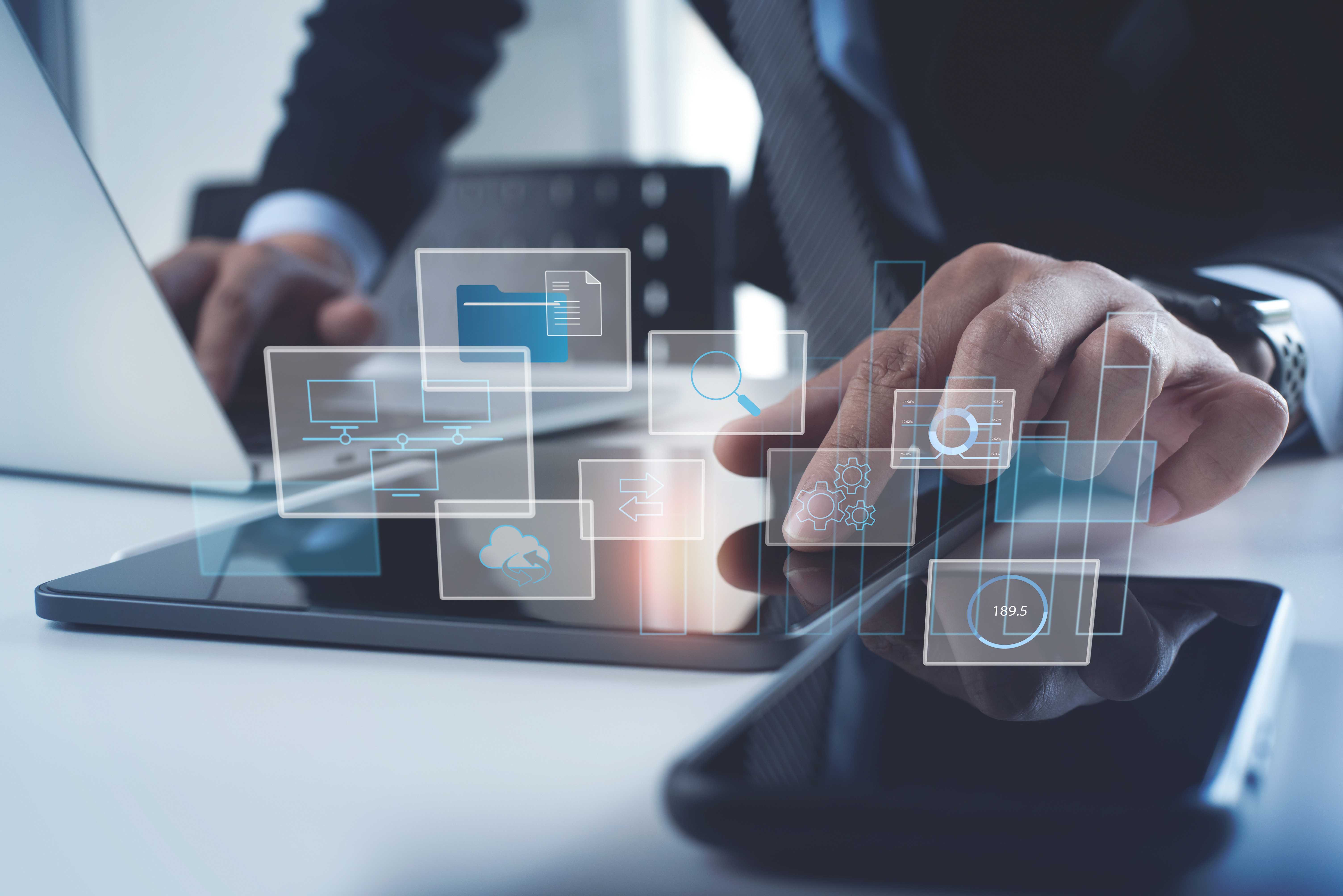 Data Management System. Analyst working with business Analytics documents on computer to make report with KPI and connected to database. Corporate strategy for finance, business operations