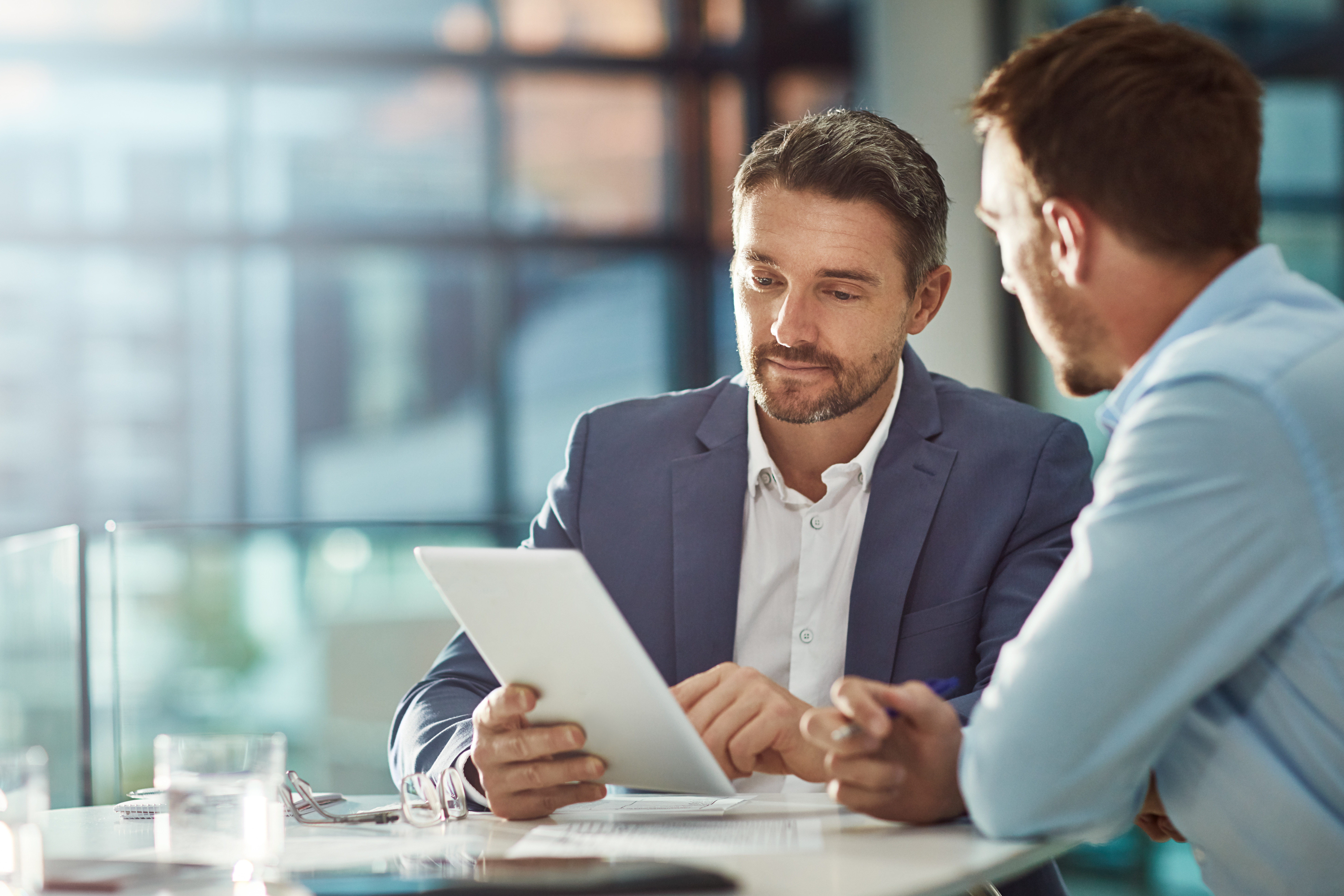 Teamwork meeting, tablet and business people in office workplace. Collaboration, technology and workers, men or employees with touchscreen planning sales, research or financial strategy